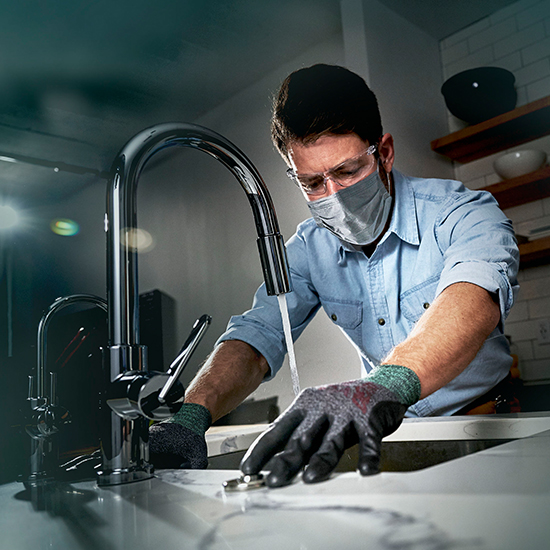 Photoshoot image of plumber used for InSinkErator brand awareness campaign